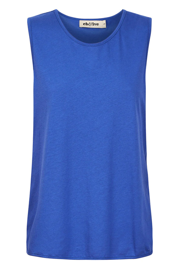 The Verano Tank is all about comfort and versatility, crafted with soft and stretchy cotton. Its sleeveless design and relaxed silhouette make it ideal for standalone wear or layering to elevate an outfit. With its adaptable style, the Verano Tank pairs effortlessly with jeans for a casual vibe or tucked into a maxi skirt or wide-leg trousers for a more polished look.