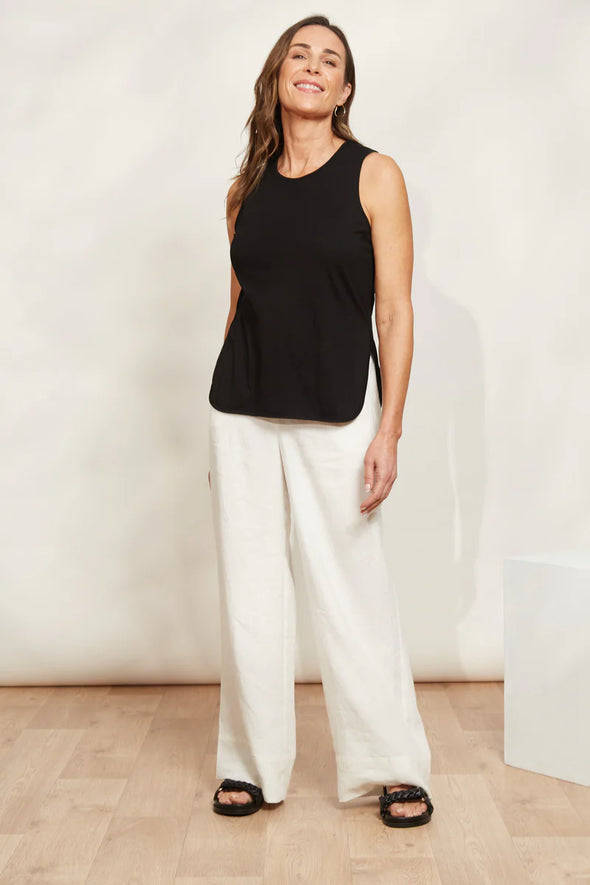 The Verano Tank is all about comfort and versatility, crafted with soft and stretchy cotton. Its sleeveless design and relaxed silhouette make it ideal for standalone wear or layering to elevate an outfit. With its adaptable style, the Verano Tank pairs effortlessly with jeans for a casual vibe or tucked into a maxi skirt or wide-leg trousers for a more polished look.