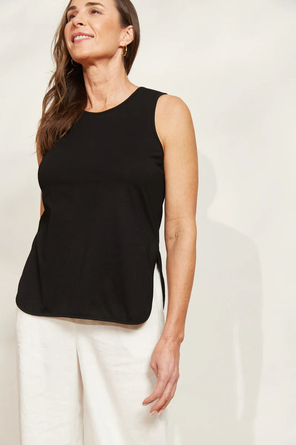 The Verano Tank is all about comfort and versatility, crafted with soft and stretchy cotton. Its sleeveless design and relaxed silhouette make it ideal for standalone wear or layering to elevate an outfit. With its adaptable style, the Verano Tank pairs effortlessly with jeans for a casual vibe or tucked into a maxi skirt or wide-leg trousers for a more polished look.