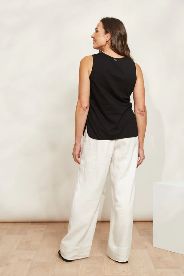 The Verano Tank is all about comfort and versatility, crafted with soft and stretchy cotton. Its sleeveless design and relaxed silhouette make it ideal for standalone wear or layering to elevate an outfit. With its adaptable style, the Verano Tank pairs effortlessly with jeans for a casual vibe or tucked into a maxi skirt or wide-leg trousers for a more polished look.