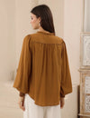 Bringing a warm glow to your everyday style with the rich bronze-earthy colour-way. Featuring a softly draped shape and V neckline - It is a simple to style staple.