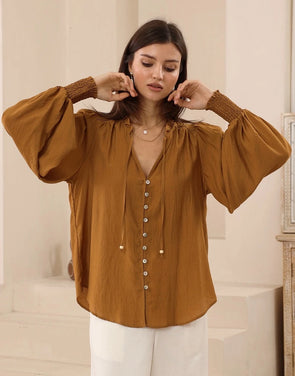 Bringing a warm glow to your everyday style with the rich bronze-earthy colour-way. Featuring a softly draped shape and V neckline - It is a simple to style staple.