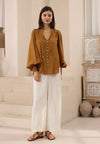 Bringing a warm glow to your everyday style with the rich bronze-earthy colour-way. Featuring a softly draped shape and V neckline - It is a simple to style staple.