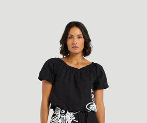 Add a playful twist to your summer wardrobe with this cropped cotton top, featuring short sleeves and fun balloon details at the hem and cuffs for a whimsical shape. The delicate daisy print on the front brings a fresh, floral pop, perfect for warm days. Pair it with the matching Daisy skirt for a charming, coordinated look that’s full of playful summer vibes.