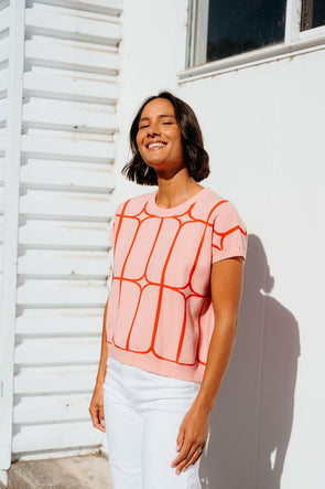 Stay cool and stylish in this summer-ready knit vest that’s full of playful charm. Made from soft knit fabric, it features a bold contrast trellis pattern that adds eye-catching texture. Whether layered over a crisp shirt or worn solo with tailored shorts, this vest brings a fun mix of structure and softness for a polished yet relaxed vibe.