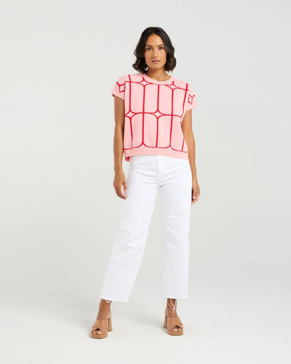 Stay cool and stylish in this summer-ready knit vest that’s full of playful charm. Made from soft knit fabric, it features a bold contrast trellis pattern that adds eye-catching texture. Whether layered over a crisp shirt or worn solo with tailored shorts, this vest brings a fun mix of structure and softness for a polished yet relaxed vibe.