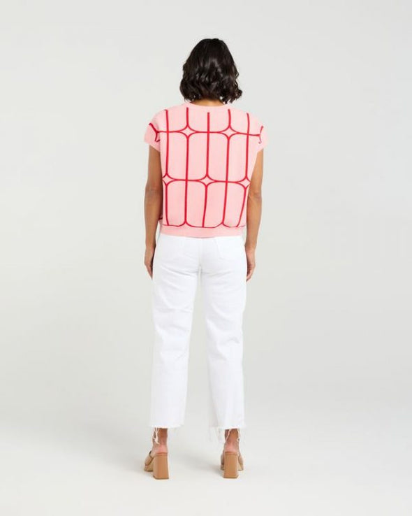 Stay cool and stylish in this summer-ready knit vest that’s full of playful charm. Made from soft knit fabric, it features a bold contrast trellis pattern that adds eye-catching texture. Whether layered over a crisp shirt or worn solo with tailored shorts, this vest brings a fun mix of structure and softness for a polished yet relaxed vibe.