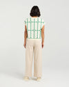 Stay cool and stylish in this summer-ready knit vest that’s full of playful charm. Made from soft knit fabric, it features a bold contrast trellis pattern that adds eye-catching texture. Whether layered over a crisp shirt or worn solo with tailored shorts, this vest brings a fun mix of structure and softness for a polished yet relaxed vibe.