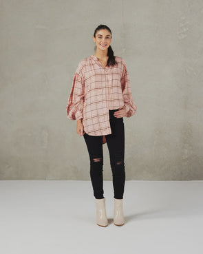 Taking the shirt trend to the next level this stunning shirt featuring mandarin collar, dropped shoulder and full sleeve with twisted knot feature is the epitome of cool  COLOUR Pink Windowpane Plaid  FABRIC INFO Woven Main Fabric:&nbsp;51% Cupro 39% Viscose 10% Polyester