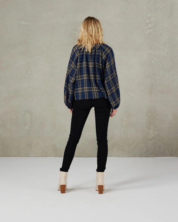 There is something so appealing about this soft tartan plaid fabric in this gorgeous round neck top with full raglan sleeves; the neckline has a self-fabric band with button  COLOUR Ink Tartan  FABRIC INFO Drapey woven Main Fabric:&nbsp;65% Polyester&nbsp; 35% Rayon Lining: 100% Polyester