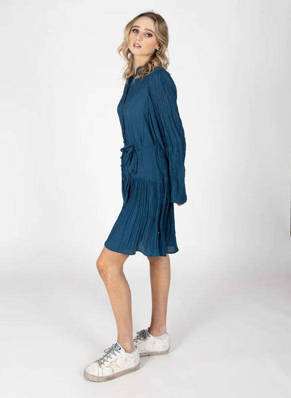 The Art Dress is a great addition to your wardrobe, layer it up in the colder months and it will transition to warmer ones too. Featuring soft gathering on the sleeve and dropped waist detailing with pleat detailing around the skirt.