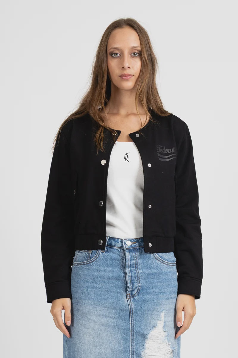 Cropped bomber silhouette
Heavyweight fleece fabrication
Collarless round neckline
Silver snap button front
Embroidered Federation script logo
Ribbed cuffs and hem
Side seam pockets
Standard fit