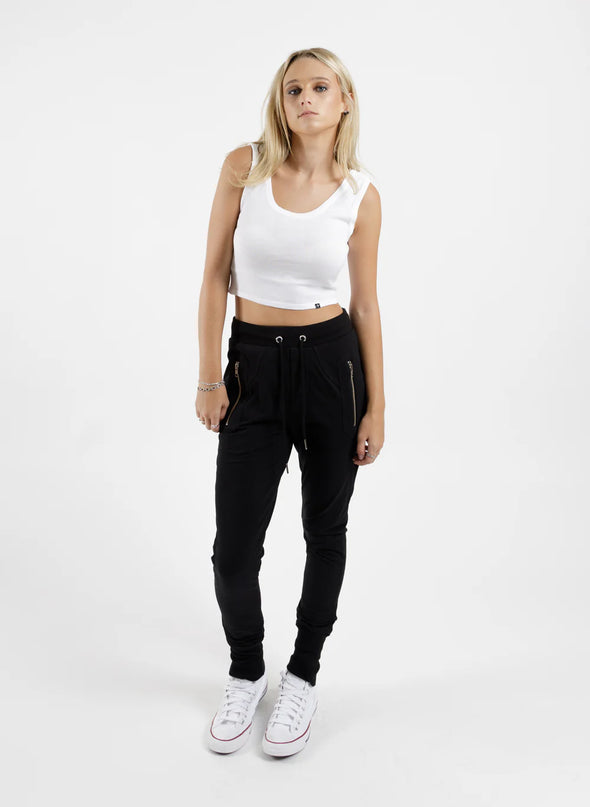 Our much-loved slim leg, drop crotch trackies. The Escape Trackie features silver metal zip detailing upfront and a patch pocket on left leg.  Finished off with wide rib cuffs and ribbed waistband pulled together with drawstring ties. Wear them your way sitting on the hip or high on the waist.&nbsp;