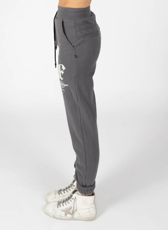 These will become your new season classic pant. High-waisted with a tailored fit through the hips. Keep the silver dome detailing fastened for a sleek, simple pant, or team with a pair of sneakers to make your look more casual. With each dome except the top two being able to open and close, these pants are a wardrobe staple thanks to their versatility.