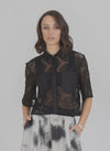 Elevate your style with the Lace it Shirt, where delicate lace meets refined comfort. This lightweight, breathable piece contours gracefully to your silhouette, adding a subtle texture that enhances any outfit. Whether layered or worn alone, it effortlessly transitions from casual days to elegant evenings, embodying timeless sophistication with ease.