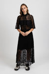 Enhance your wardrobe with the Lace It Skirt, featuring a delicate black lace overlay enriched by a stunning floral print. This elegant skirt combines grace and sophistication, making it ideal for formal events or polished daily wear. Its flowing silhouette moves gracefully with you, offering a timeless and flattering profile that complements your natural elegance.