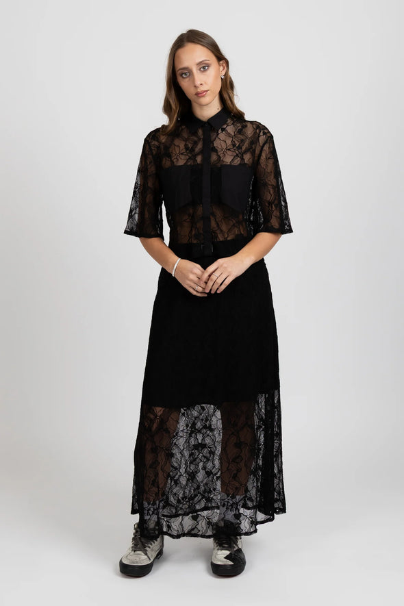 Enhance your wardrobe with the Lace It Skirt, featuring a delicate black lace overlay enriched by a stunning floral print. This elegant skirt combines grace and sophistication, making it ideal for formal events or polished daily wear. Its flowing silhouette moves gracefully with you, offering a timeless and flattering profile that complements your natural elegance.