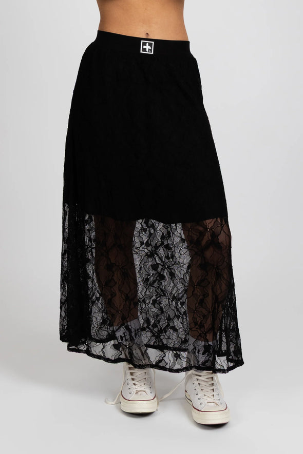 Enhance your wardrobe with the Lace It Skirt, featuring a delicate black lace overlay enriched by a stunning floral print. This elegant skirt combines grace and sophistication, making it ideal for formal events or polished daily wear. Its flowing silhouette moves gracefully with you, offering a timeless and flattering profile that complements your natural elegance.