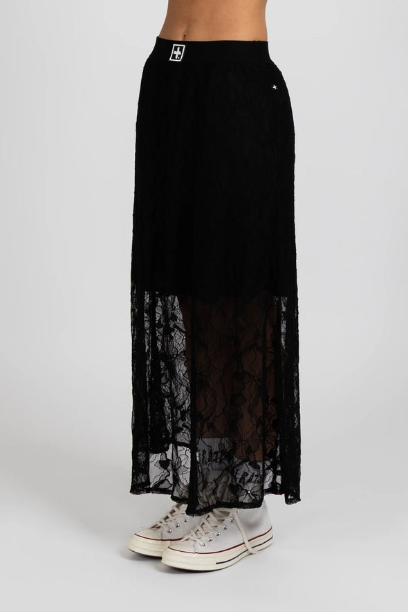 Enhance your wardrobe with the Lace It Skirt, featuring a delicate black lace overlay enriched by a stunning floral print. This elegant skirt combines grace and sophistication, making it ideal for formal events or polished daily wear. Its flowing silhouette moves gracefully with you, offering a timeless and flattering profile that complements your natural elegance.