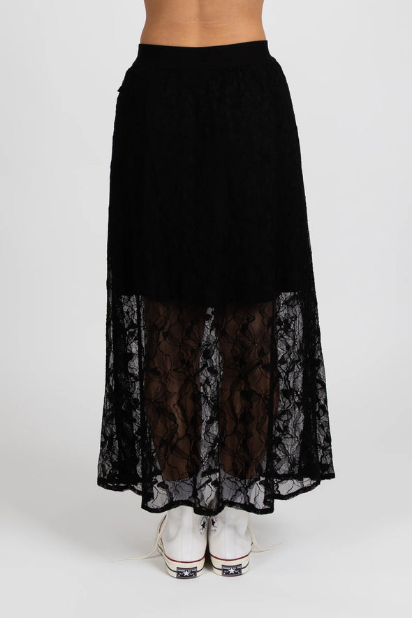 Enhance your wardrobe with the Lace It Skirt, featuring a delicate black lace overlay enriched by a stunning floral print. This elegant skirt combines grace and sophistication, making it ideal for formal events or polished daily wear. Its flowing silhouette moves gracefully with you, offering a timeless and flattering profile that complements your natural elegance.