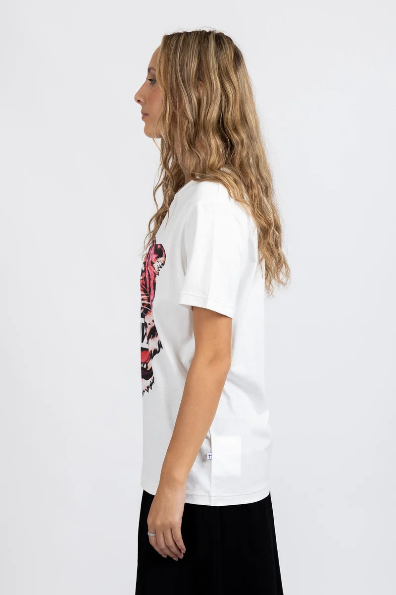 The Rush Tee in The Love Tiger Print is a bold statement piece that brings wild style to your everyday wardrobe. Featuring a striking Tiger print design, this tee combines comfort with contemporary edge. Perfect for layering or wearing solo, it's versatile enough for casual outings, weekend adventures, or relaxed social gatherings.

The classic tee silhouette ensures a flattering fit that works with your existing basics and standout pieces alike. Make a confident fashion choice with this eye-catching essent