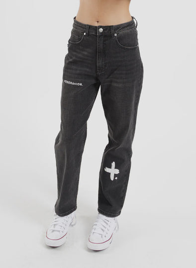 Introducing our Take It Easy Jean. Made with high-quality denim and a relaxed fit, these Black jeans are perfect for everyday wear. The versatile design and ample room for movement make them a must-have addition to your wardrobe. So comfy, you'll never want to take them off! With iconic printed logos on the legs and a fun worded print on the back.