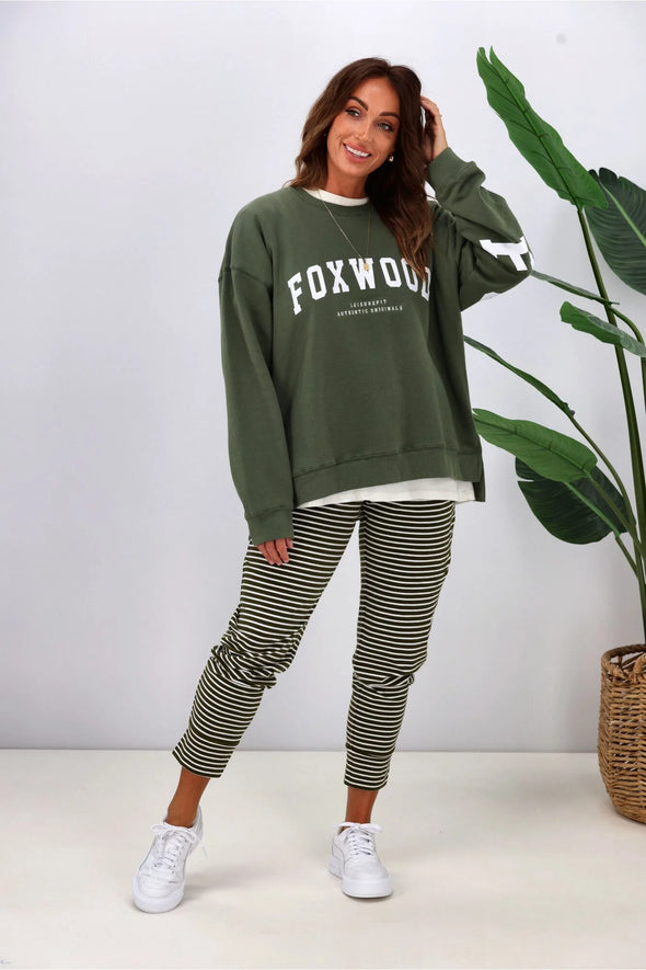 Introducing the must-have for this season: the Foxwood Interval Crew! With its timeless crew neckline and front chest print, this sweatshirt makes a subtle statement. But don't be fooled, the oversized back and shoulder print add a bold touch. Made with Foxwood LeisureFit fleece, it's the perfect blend of classic and standout style.