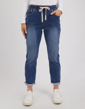 Looking for a jean with the comfort of a jogger? Look no further. The Juliette Denim Jogger looks like a classic 5 pocket jean but boast the stretch and elastication of a jogger ensuring comfort all day long! These mid-blue washed jeans are constructed from lightweight 11.5oz denim and a ready to wear!