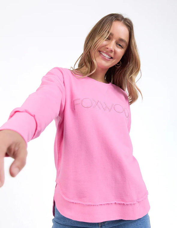 Front chest embroidery
Raw edge detail
Curved hem
100% Cotton