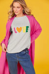 Highlighted by a woven 'LOVE' motif at the forefront, the Boden Love Jumper is a heartwarming addition to your wardrobe. This knit jumper exudes casual charm with a round neck, raglan sleeves, and playful contrasting cuffs. Crafted from comfortable cotton construction, it's perfect for everyday wear. Pair it with loose linen pants and slides for a cool, casual vibe!