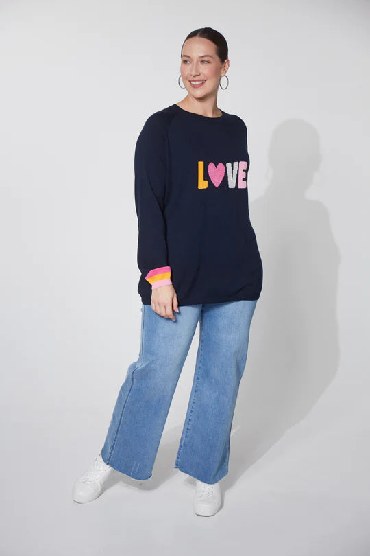 Highlighted by a woven 'LOVE' motif at the forefront, the Boden Love Jumper is a heartwarming addition to your wardrobe. This knit jumper exudes casual charm with a round neck, raglan sleeves, and playful contrasting cuffs. Crafted from comfortable cotton construction, it's perfect for everyday wear. Pair it with loose linen pants and slides for a cool, casual vibe!