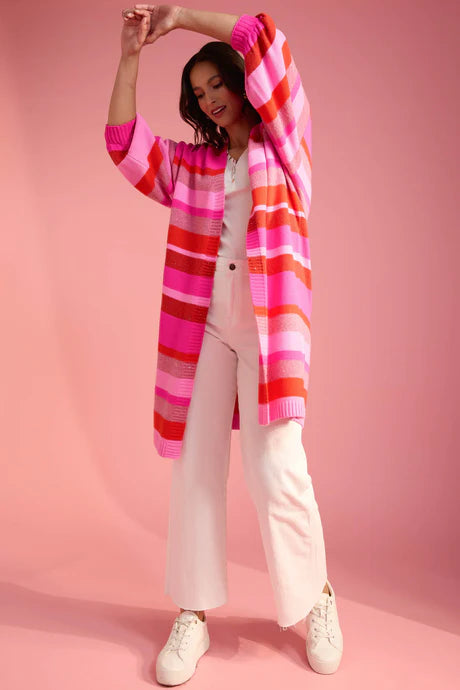 Introducing the Yuma Cardigan, a statement piece with vibrant high-contrast stripes, glimmering Lurex threading, and a relaxed fit silhouette. The open-front design effortlessly drapes over any outfit, whether light or layered. Crafted from a luxurious wool blend, this cardigan will elevate your style and bring energy to your next adventure.
