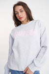 Stay cozy and stylish in the Huffer Crewneck! With a playful twist on the classic crewneck, this sweater features a bold pale pink "Huffer" graphic across the chest in bubble letters. Perfect for any occasion.&nbsp;