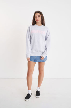 Stay cozy and stylish in the Huffer Crewneck! With a playful twist on the classic crewneck, this sweater features a bold pale pink "Huffer" graphic across the chest in bubble letters. Perfect for any occasion.&nbsp;