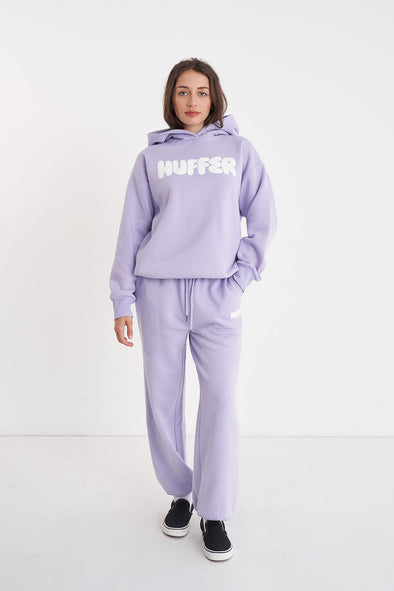 Get ready to rock a cool and playful vibe with our Huffer Hoodie! Featuring bold huffer branding in fun bubble writing, this purple hoodie is the perfect addition to any quirky outfit. Stay cool and stay stylish with this must-have piece.