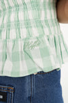 Sweet, fresh, and effortlessly flattering — the Gigi Shirred Top is your go-to for easy summer styling. Featuring a soft gingham check in Matcha green and Chalk white, this top brings a playful twist to classic patterning.