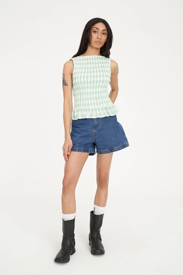 Sweet, fresh, and effortlessly flattering — the Gigi Shirred Top is your go-to for easy summer styling. Featuring a soft gingham check in Matcha green and Chalk white, this top brings a playful twist to classic patterning.