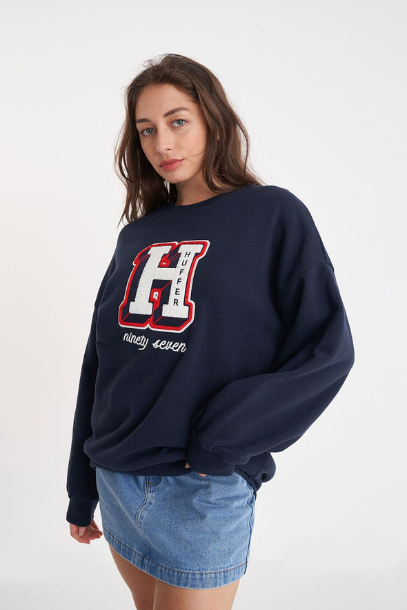 Stay warm and stylish in this classic Huffer crewneck. The midnight color provides a stylish twist, while the big Huffer H detailing adds a touch of personality. Perfect for any casual occasion. (Just don't wear it to a formal event, that's not cool.)