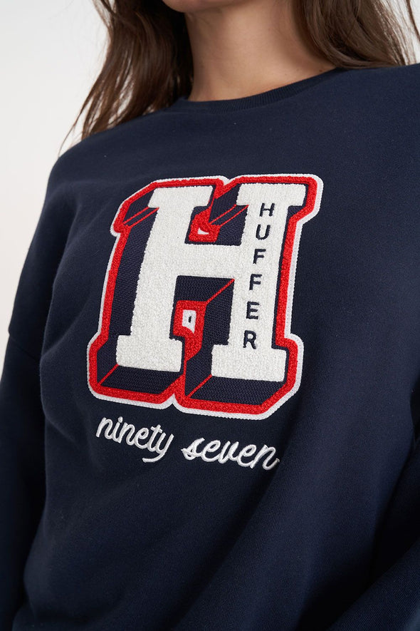 Stay warm and stylish in this classic Huffer crewneck. The midnight color provides a stylish twist, while the big Huffer H detailing adds a touch of personality. Perfect for any casual occasion. (Just don't wear it to a formal event, that's not cool.)