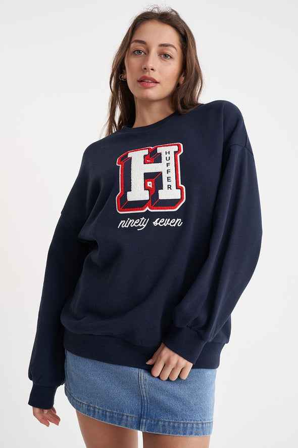 Stay warm and stylish in this classic Huffer crewneck. The midnight color provides a stylish twist, while the big Huffer H detailing adds a touch of personality. Perfect for any casual occasion. (Just don't wear it to a formal event, that's not cool.)