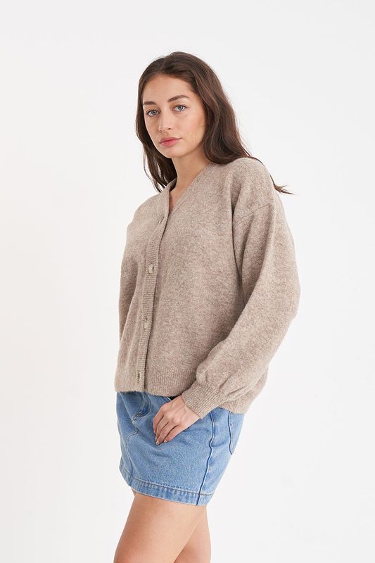 Add a touch of quirk to your wardrobe with The Kendall Cardigan. This versatile wardrobe essential is perfect for any season, thanks to its lightweight and comfortable blend. Whether you're knitting up a storm or just looking for a stylish layer, this fully fashioned knit cardigan has got you covered.