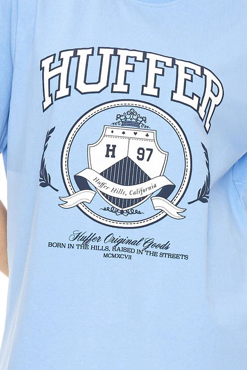 Experience comfort and style in the Huffer Relaxed Tee! Made with 220gsm cotton fabric, it is a thicker cotton perfect&nbsp; this cornflower blue tee features a bold 'Huffer Hills' college inspired print. Whether you're hitting the shops or lounging at home, this tee has got you covered.