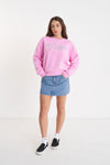 A classic Huffer crewneck in an icon shade of pink; Bon Bon. Rope detail spelling out the word Huffer.