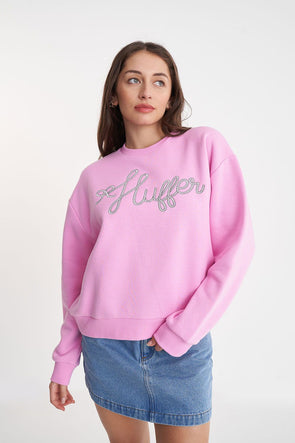 A classic Huffer crewneck in an icon shade of pink; Bon Bon. Rope detail spelling out the word Huffer.