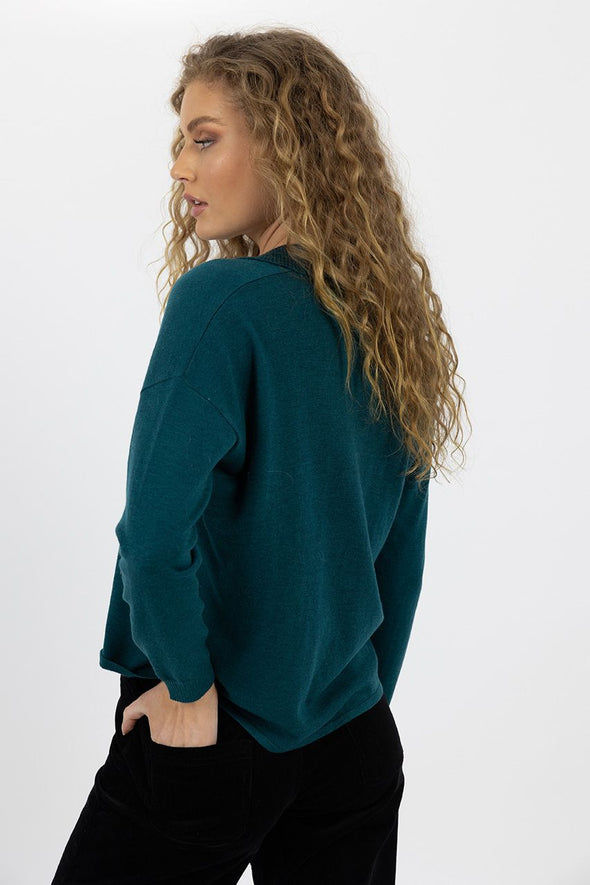 A knit we know will be reached for time and time again. Featuring a V neck and collared neckline giving this top a fun detail. with a midweight feel it offers warmth with remaining sleek and fitted. Sea Blue is a dream colourway to add some colour to your winter wardrobe.