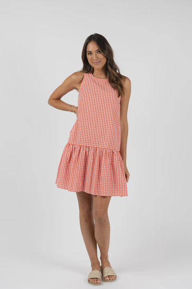 Introducing the "one outfit wonder" for summer - our gingham seersucker dress! Stay cool while looking cute with minimal effort in this low maintenance, lightweight fabric. Perfect for hot days and wash-and-wear convenience.