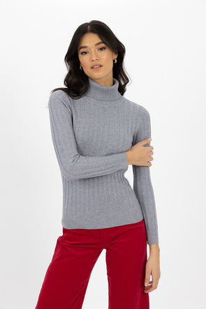 With the cooler months upon us we need to be in our layering era! The Ines Skivvy is not only the softest base layer it also adds texture with the wide ribbed sleeves and creates a snuggly high neckline with the roll over turtle neck. This will look great under a v neck knit or as the elevated basic with a denim skirt or wide leg pant. Fitted although it isn't going to cling.