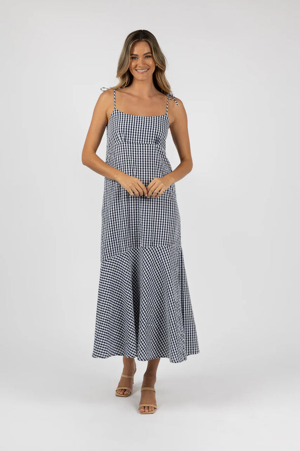 This flowy gingham dress is a must-have for any weekend plans with its soft and breathable 100% cotton material. Easily dress up with your favorite pair of heels for an effortlessly chic look. From summer shopping to dinner with the girls, this dress has got you covered.