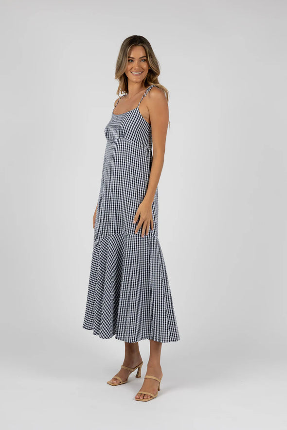 This flowy gingham dress is a must-have for any weekend plans with its soft and breathable 100% cotton material. Easily dress up with your favorite pair of heels for an effortlessly chic look. From summer shopping to dinner with the girls, this dress has got you covered.