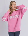 The Foxwood Interval Crew combines relaxed comfort with refined style. Featuring an oversized silhouette, ribbed detailing, and an extended back hem with side splits, this cotton blend crew works seamlessly from weekend lounging to elevated casual outings. Bold blue lettering on a rich brown base makes a quiet statement, while the soft fabric and unrestricted fit invite effortless layering and movement.

100% Cotton